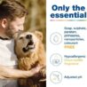 A man lovingly hugs a happy golden dog outdoors. Text beside them highlights a product’s benefits: free from harsh chemicals, hypoallergenic coco-vanilla fragrance, and adjusted pH levels.